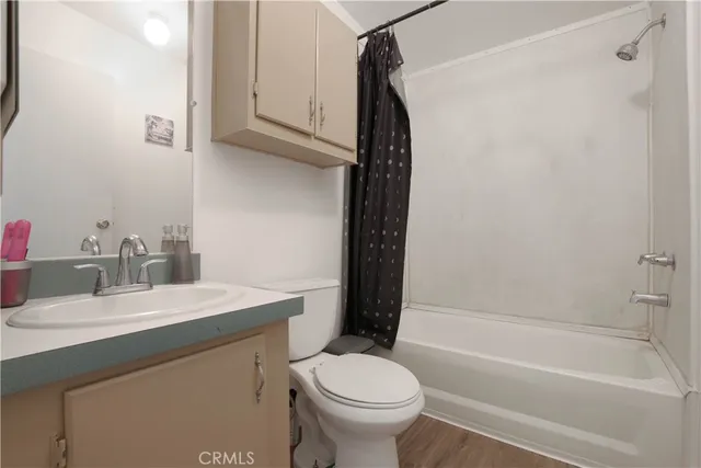 a bathroom with a sink a toilet and a bathtub