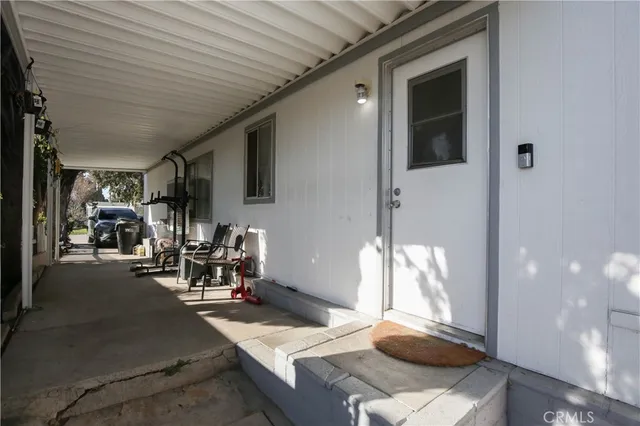 a dining room with furniture and a chandelier