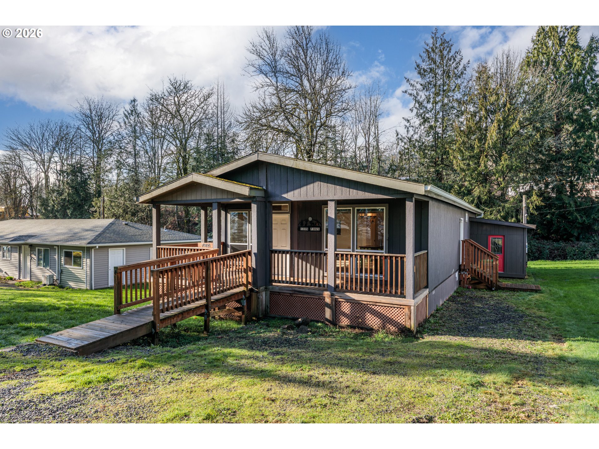 73821 Lindberg Road Rainier, OR 97048 - Photo 1 of 18 a view of a house with a yard and sitting area