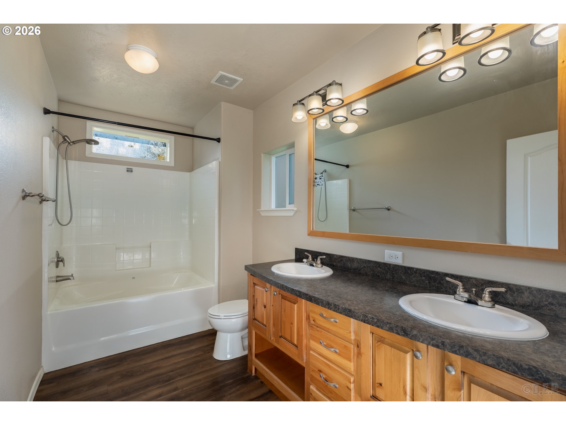 73821 Lindberg Road Rainier, OR 97048 - Photo 13 of 18 a bathroom with a granite countertop sink a toilet a mirror and shower