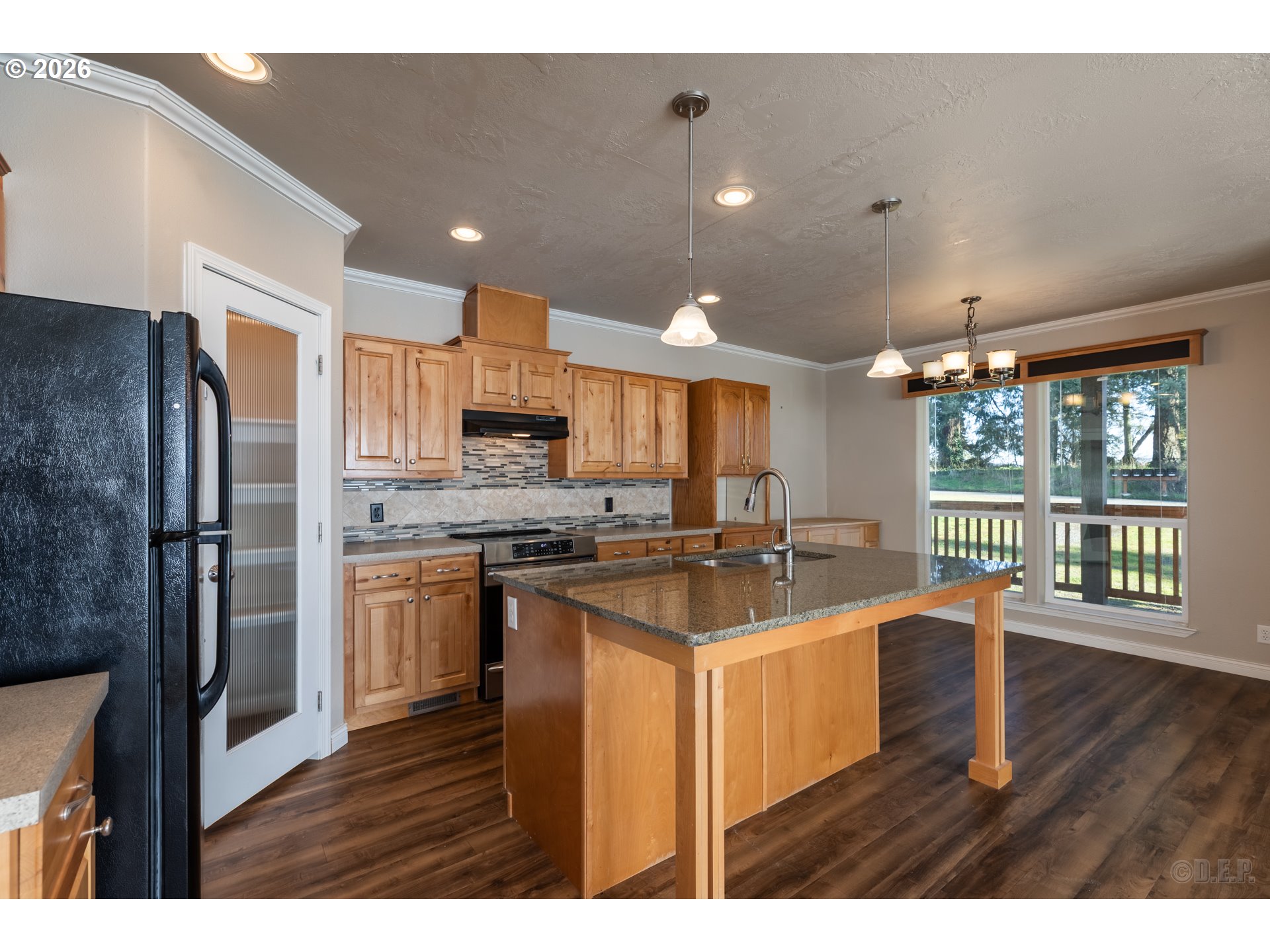 73821 Lindberg Road Rainier, OR 97048 - Photo 8 of 18 a kitchen with stainless steel appliances granite countertop a sink stove and refrigerator