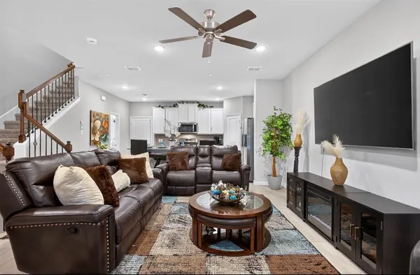 a living room with furniture and a flat screen tv