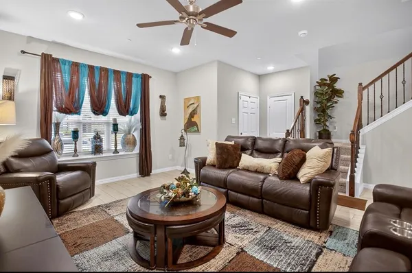 a living room with furniture and a large window