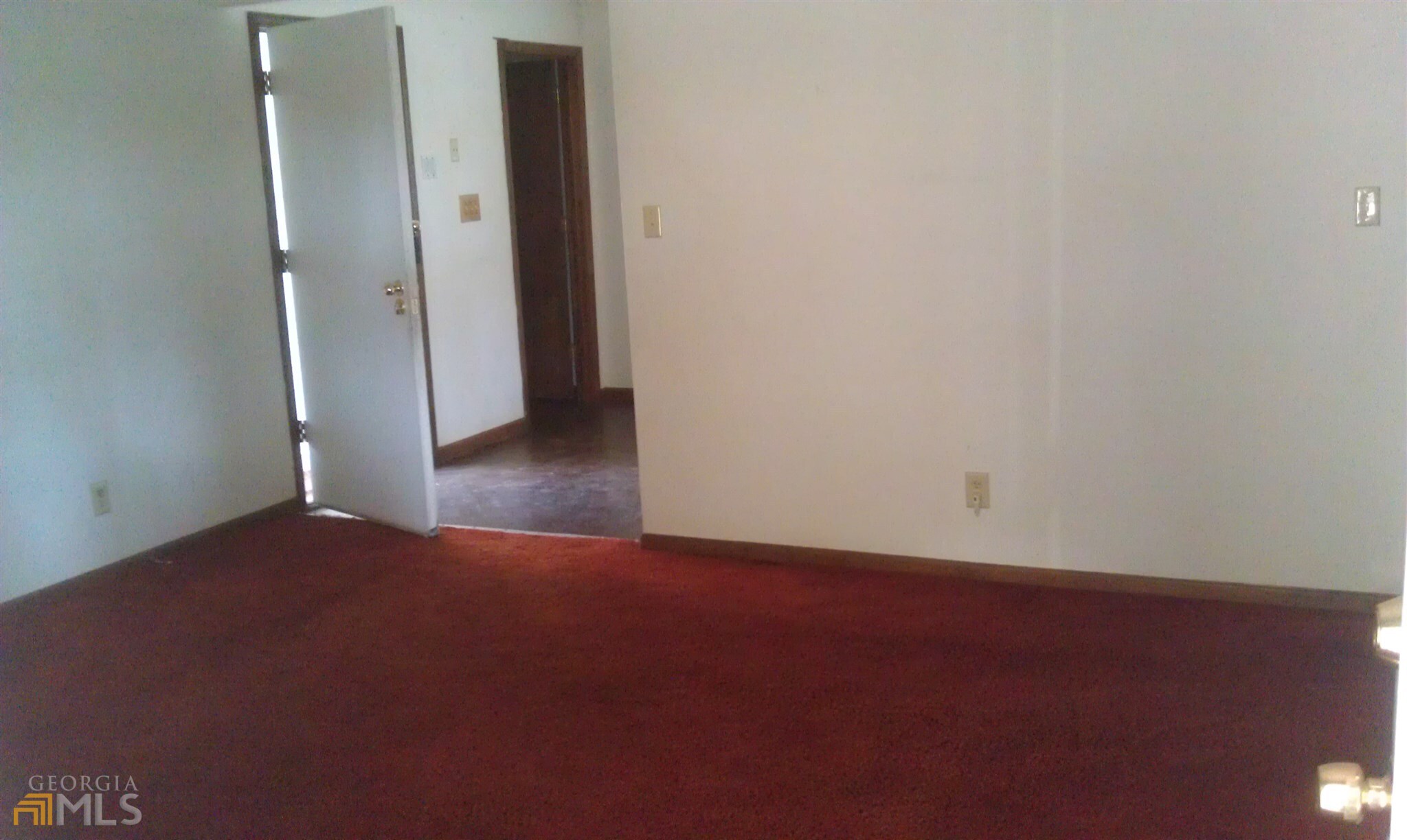 565 Womack Road Covington, GA 30016 - Photo 3 of 4 an empty room with closet