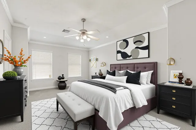 a spacious bedroom with a bed and a chandelier