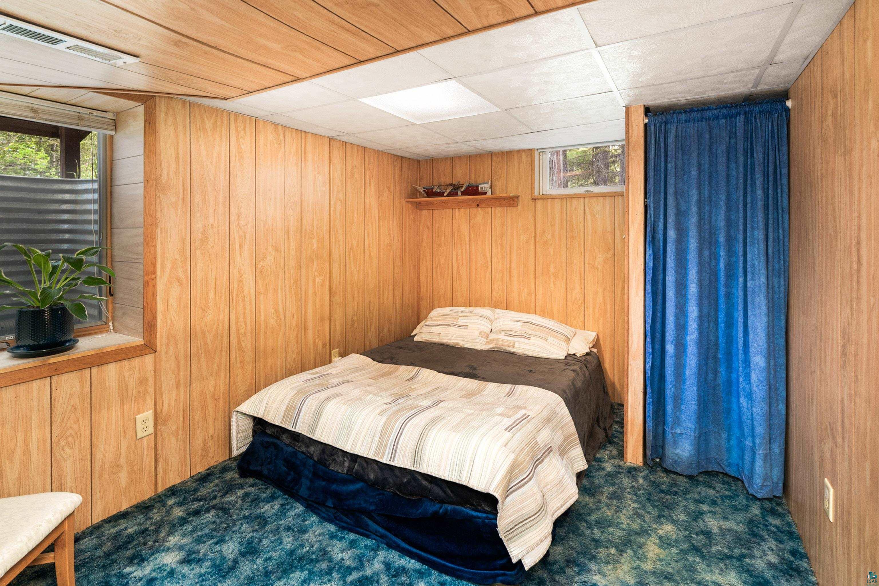4808 Midway Road Duluth, MN 55811 - Photo 38 of 57 Wood-finish paneled walls and a drop ceiling with recessed lighting