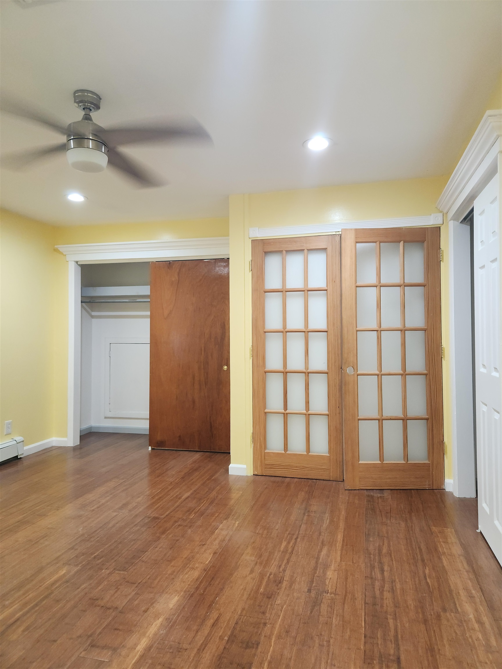 39 Terhune Avenue, Unit 2 Jersey City, NJ 07305 - Photo 6 of 10 wooden floor in an empty room with a window
