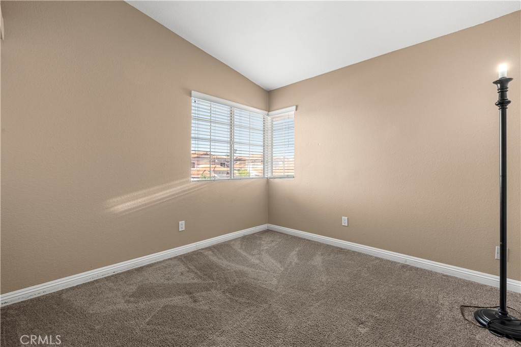 15417 Tobarra Road Fontana, CA 92337 - Photo 19 of 29 an empty room with windows