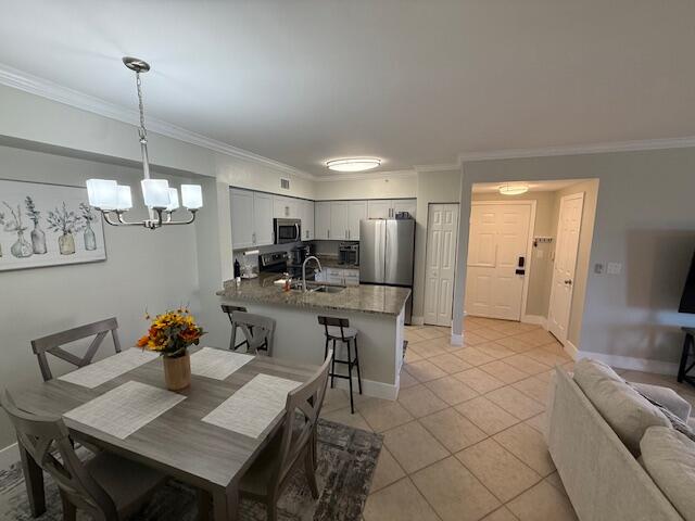 6400 Emerald Dunes Drive, Unit 301 West Palm Beach, FL 33411 - Photo 11 of 28 a view of a dining room with furniture