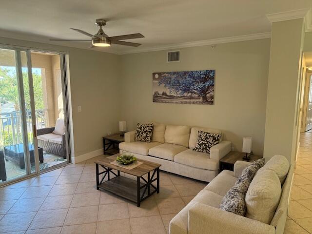 6400 Emerald Dunes Drive, Unit 301 West Palm Beach, FL 33411 - Photo 2 of 28 a living room with furniture and a large window