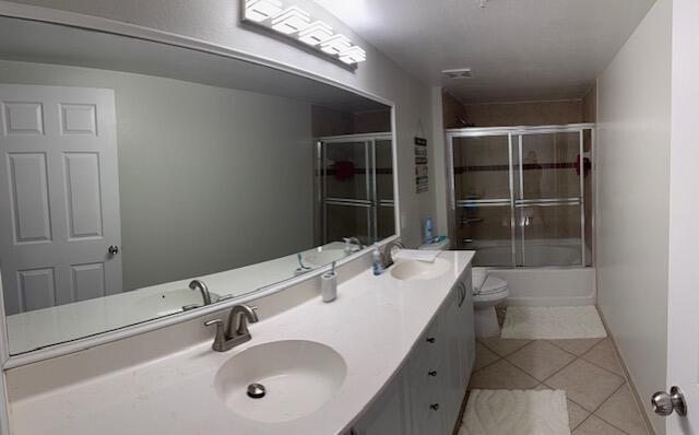 6400 Emerald Dunes Drive, Unit 301 West Palm Beach, FL 33411 - Photo 23 of 28 a bathroom with a sink a toilet and shower