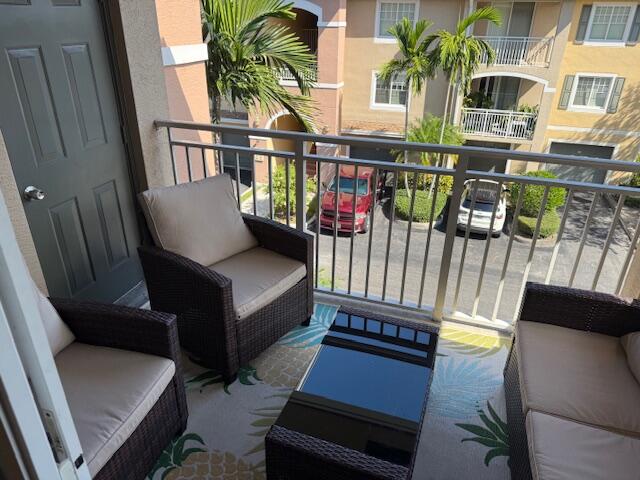6400 Emerald Dunes Drive, Unit 301 West Palm Beach, FL 33411 - Photo 4 of 28 a view of balcony with outdoor seating