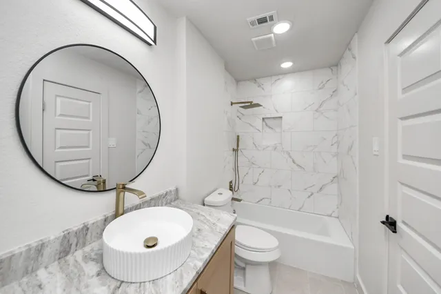 a front view of house with a garden