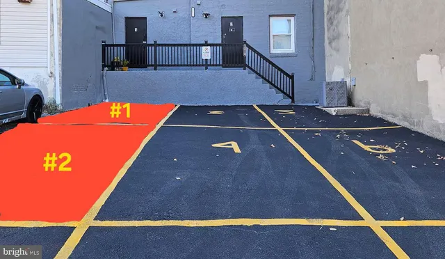 a kitchen with stainless steel appliances granite countertop a refrigerator a stove top oven a sink a dining table and chairs