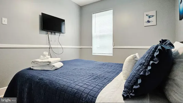 a bathroom with a double vanity sink a mirror and shower