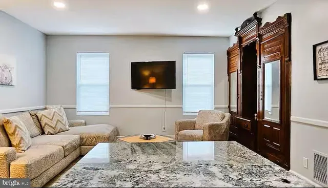 a view of a patio with table and chairs and wooden floor