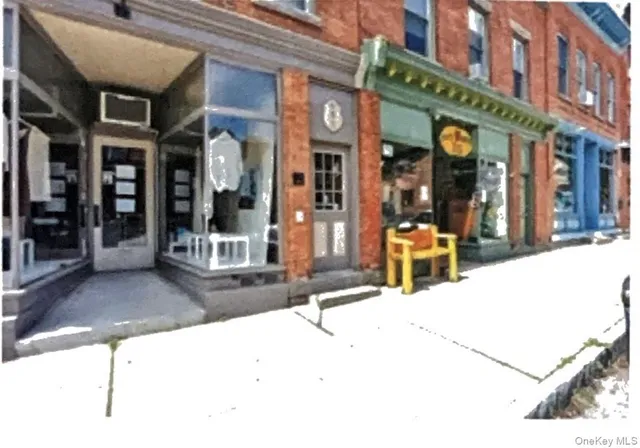 a view of hallway with wooden floor