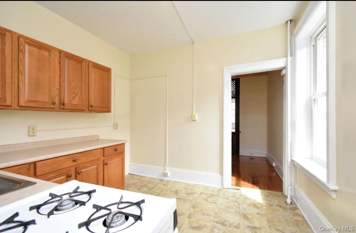 457 Main Street, Unit 1 Beacon, NY 12508 - Photo 8 of 9 a view of a kitchen with a sink and cabinets