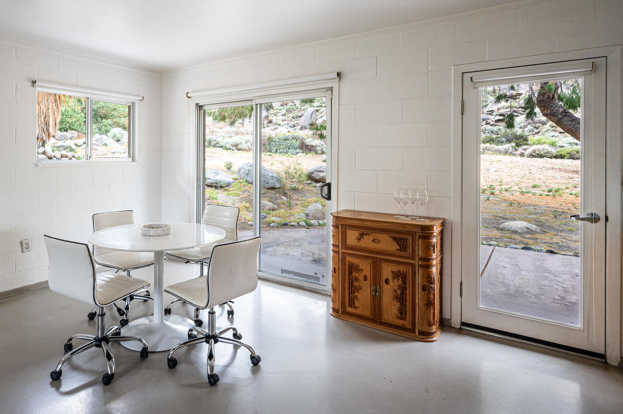 15971 Snowcreek Canyon Road Whitewater, CA 92282 - Photo 11 of 45 a living room with furniture and a window