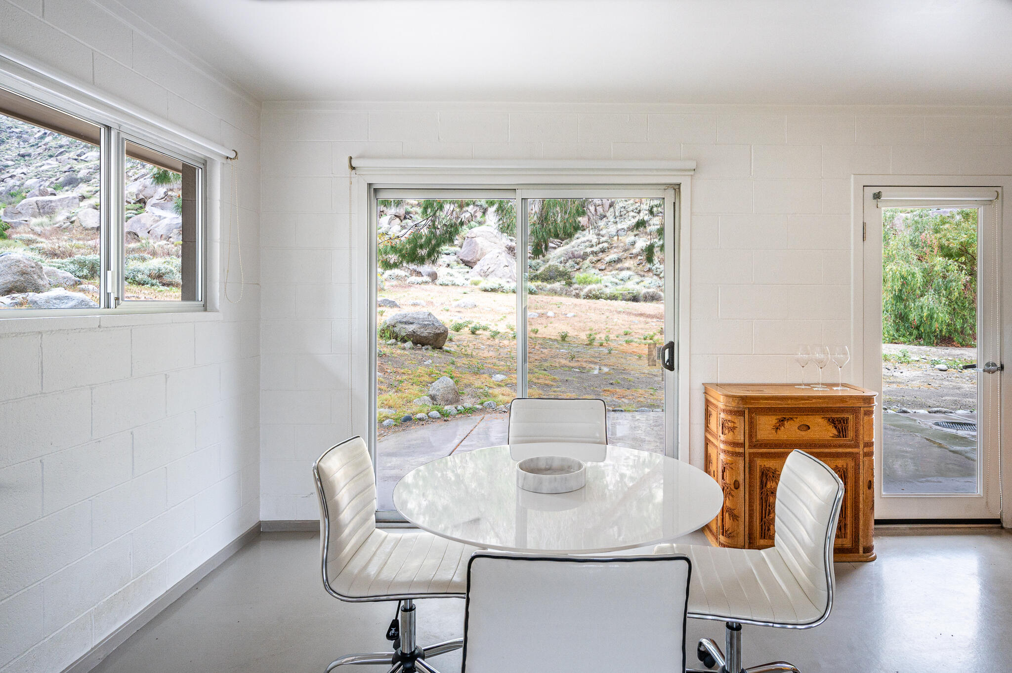 15971 Snowcreek Canyon Road Whitewater, CA 92282 - Photo 12 of 45 a dining room with furniture and window