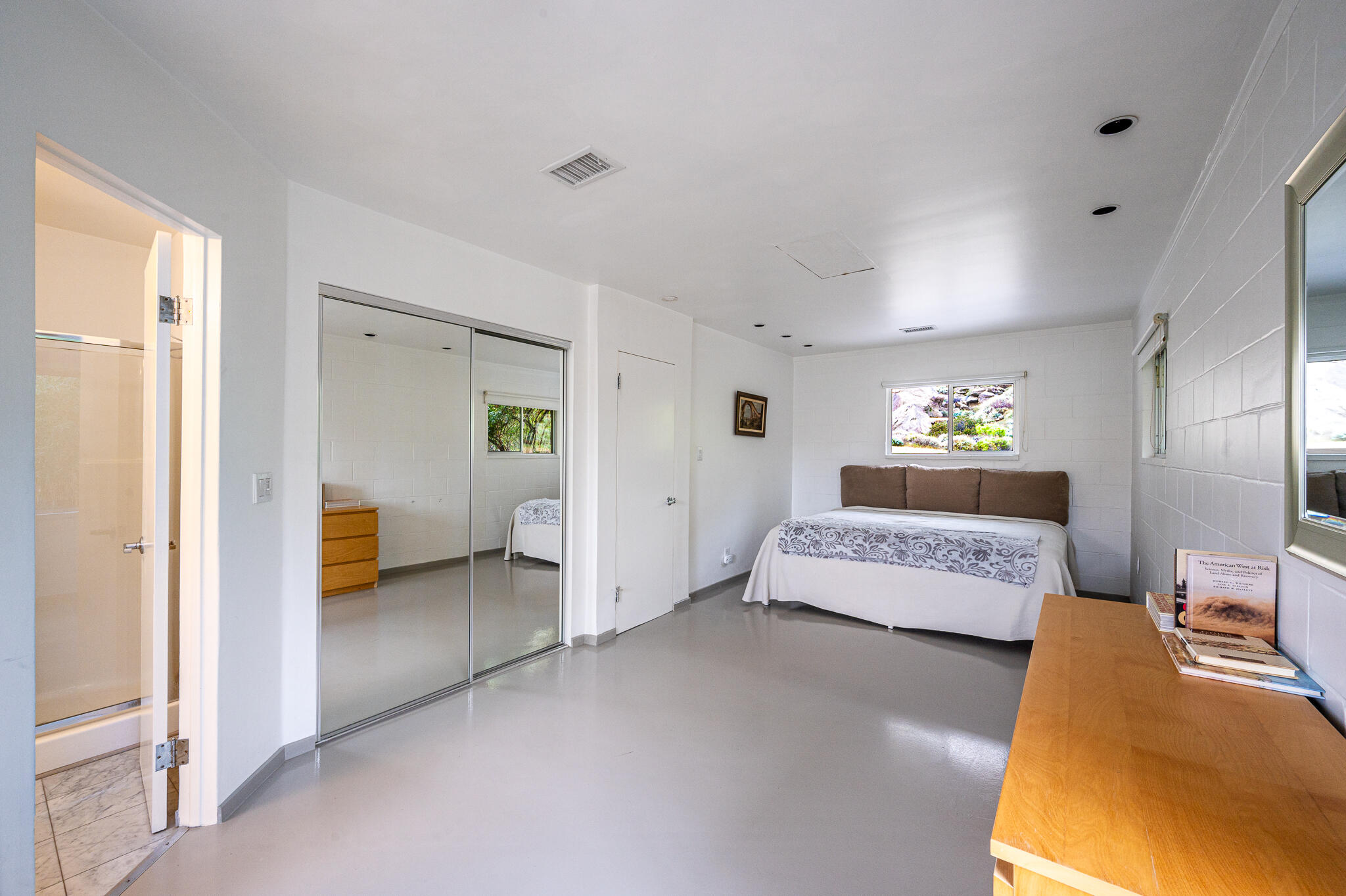 15971 Snowcreek Canyon Road Whitewater, CA 92282 - Photo 15 of 45 a view of a bedroom with furniture and windows