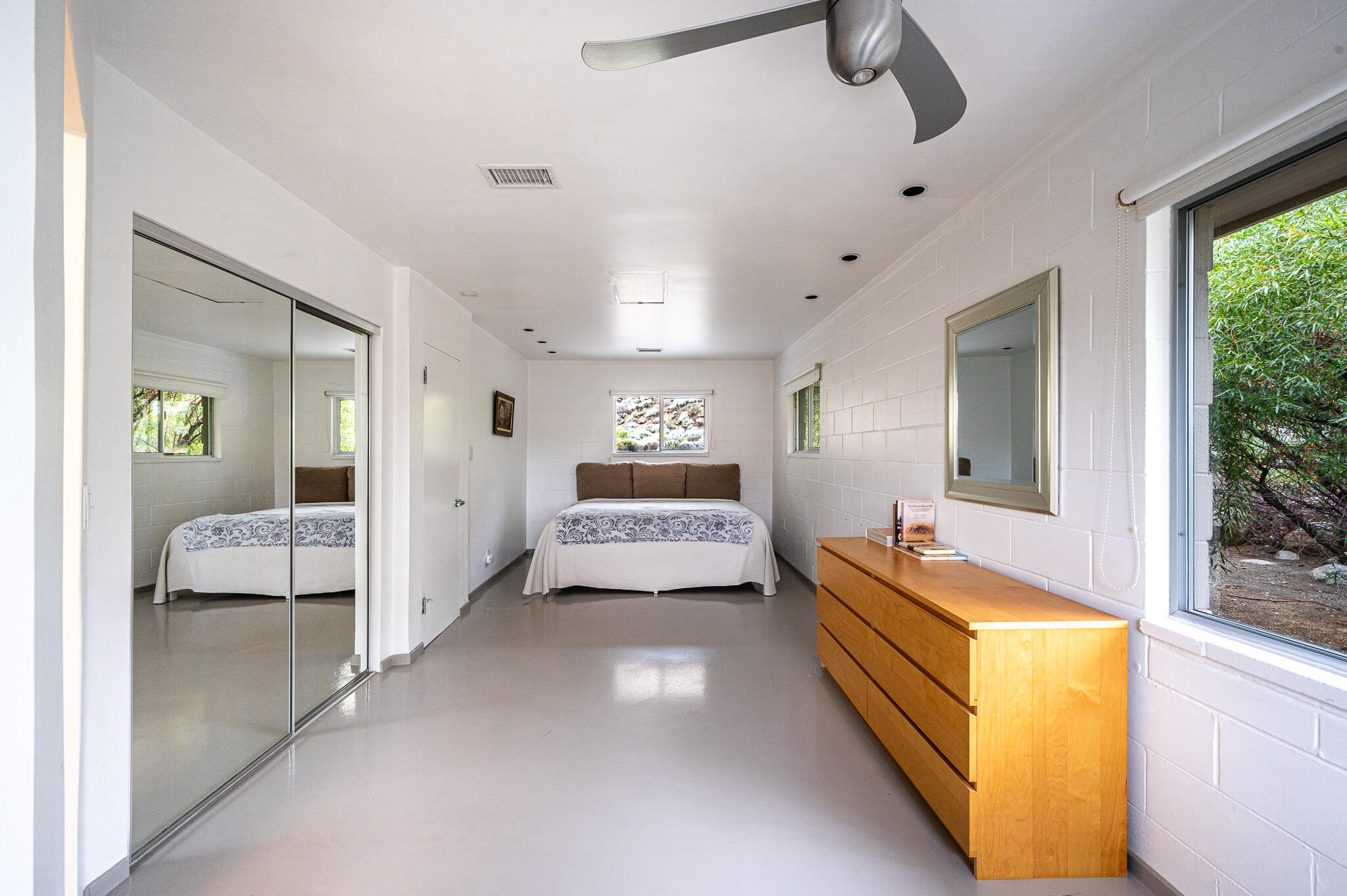 15971 Snowcreek Canyon Road Whitewater, CA 92282 - Photo 16 of 45 a bedroom with bed and window