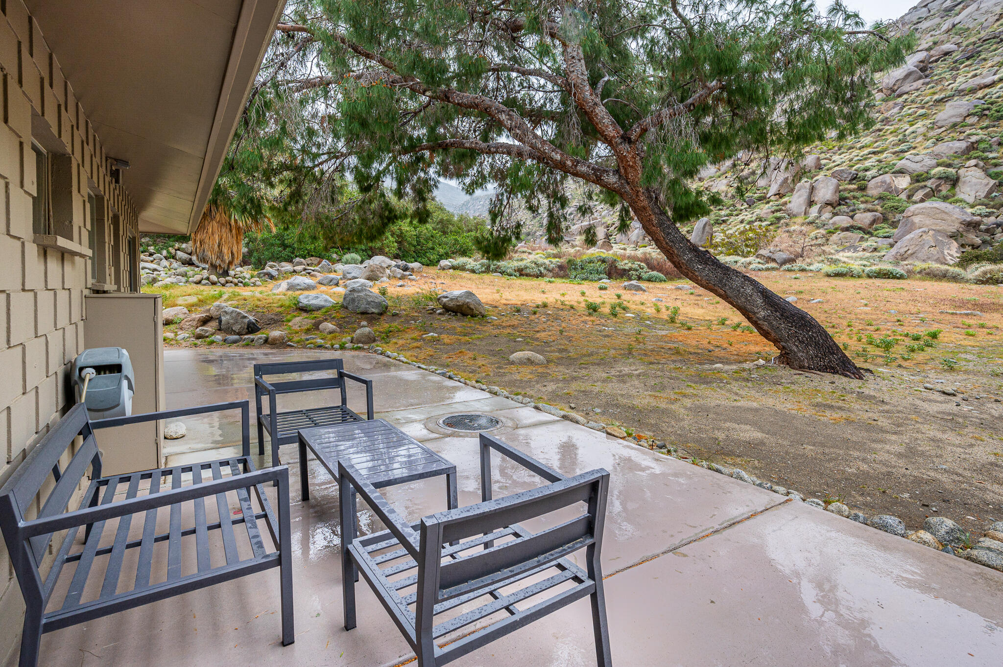 15971 Snowcreek Canyon Road Whitewater, CA 92282 - Photo 21 of 45 a view of a terrace with a bench