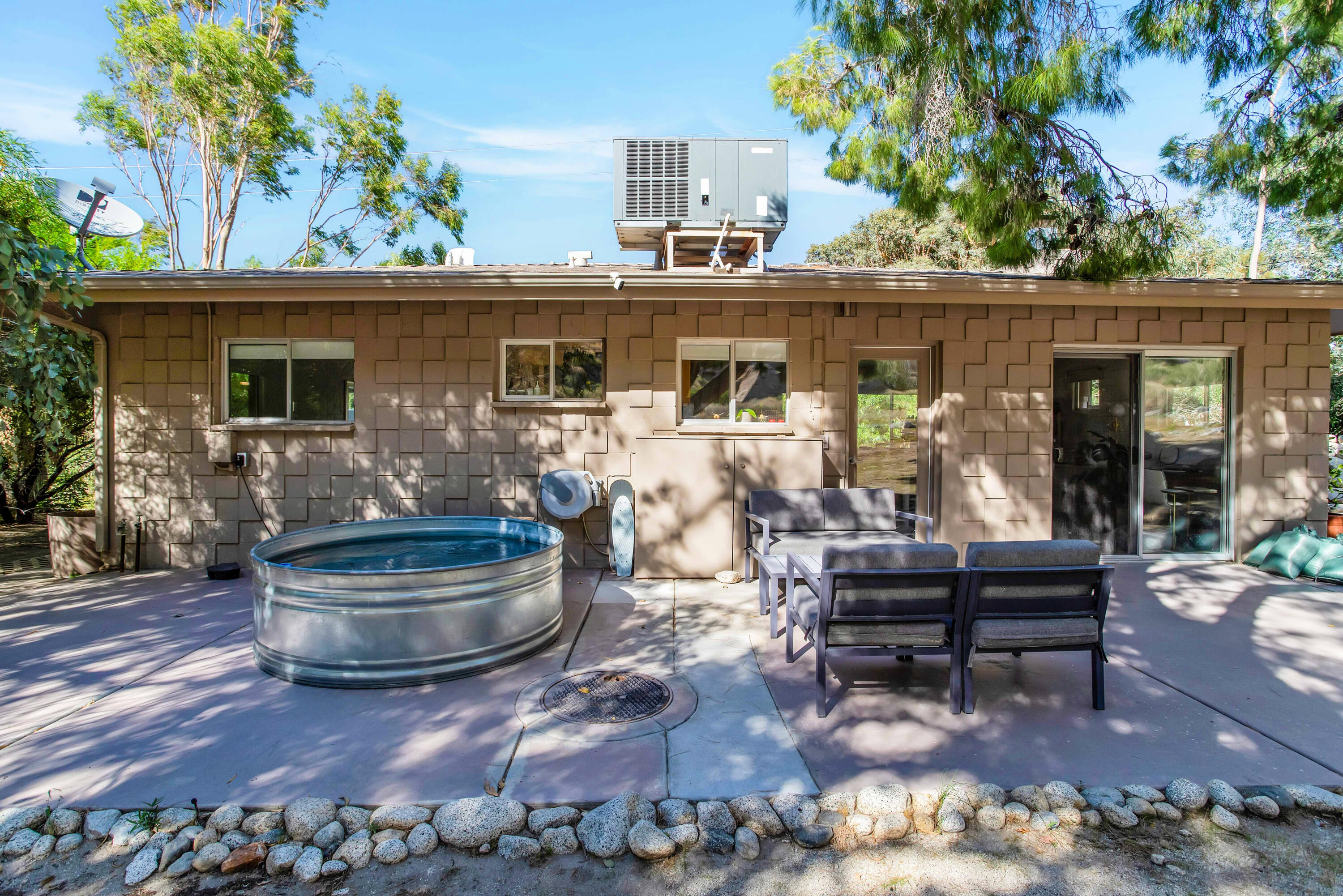15971 Snowcreek Canyon Road Whitewater, CA 92282 - Photo 37 of 45 a front view of house with outdoor seating