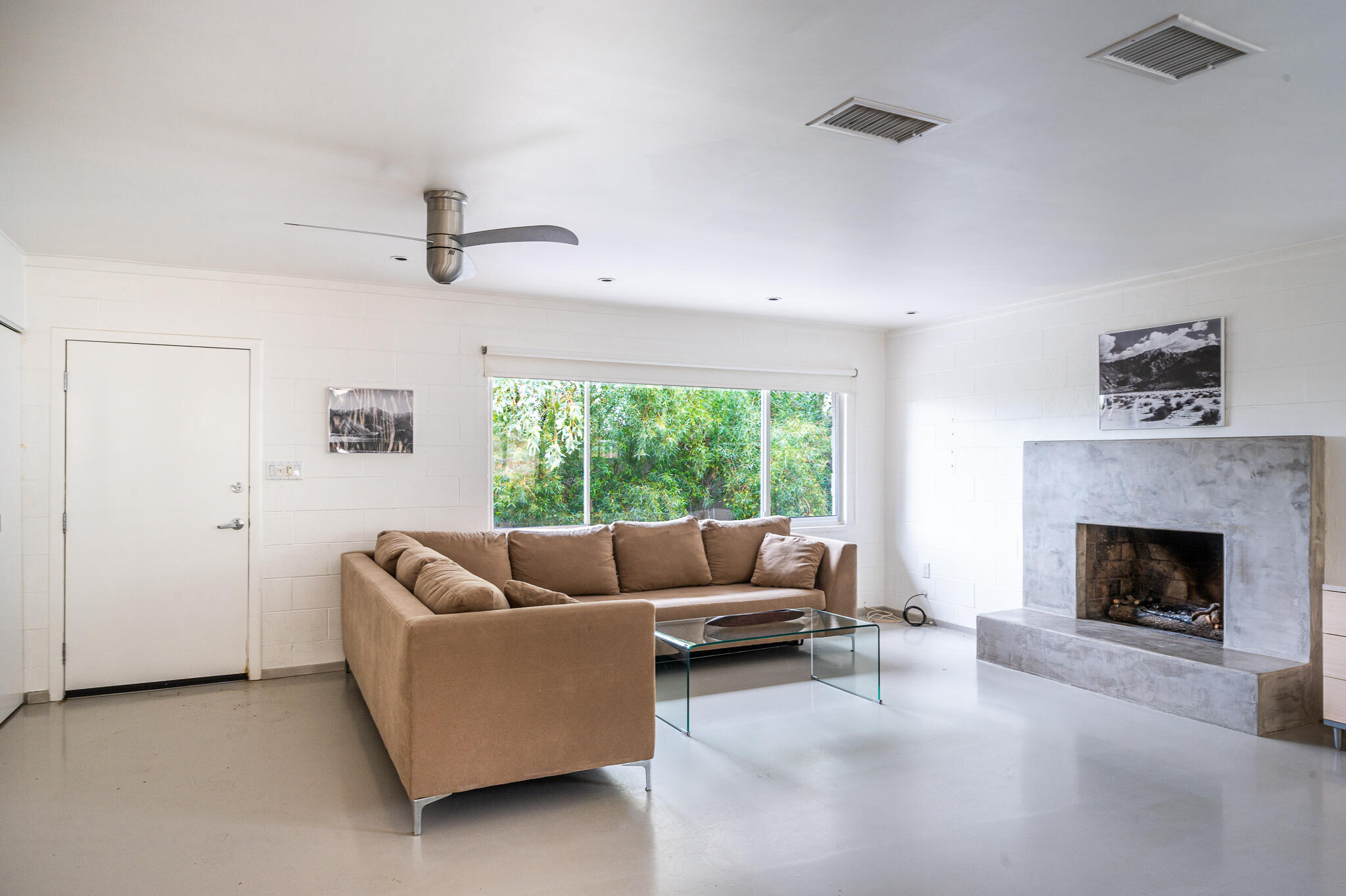15971 Snowcreek Canyon Road Whitewater, CA 92282 - Photo 4 of 45 a living room with furniture and a fireplace