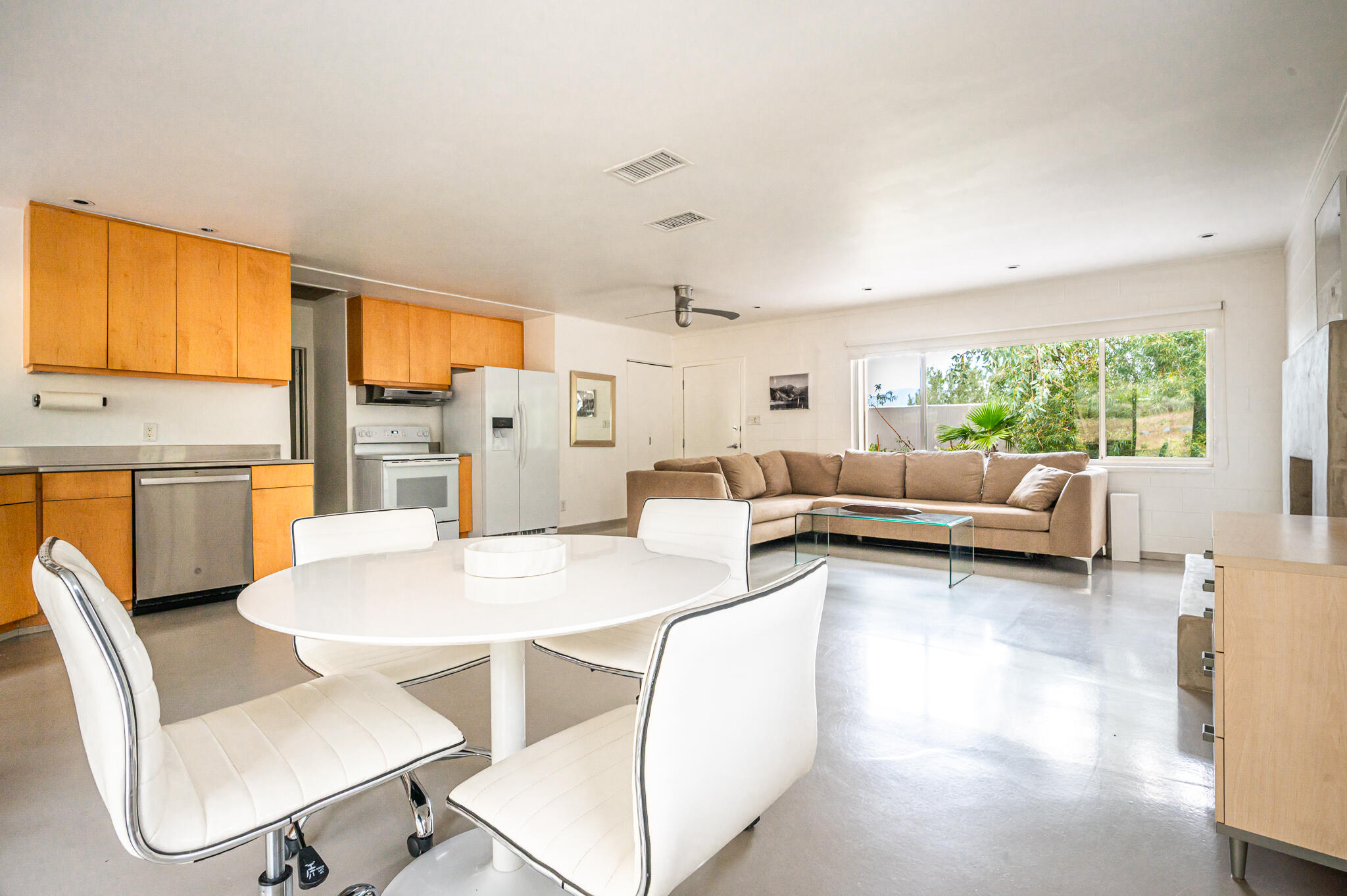 15971 Snowcreek Canyon Road Whitewater, CA 92282 - Photo 5 of 45 a living room with furniture and a large window