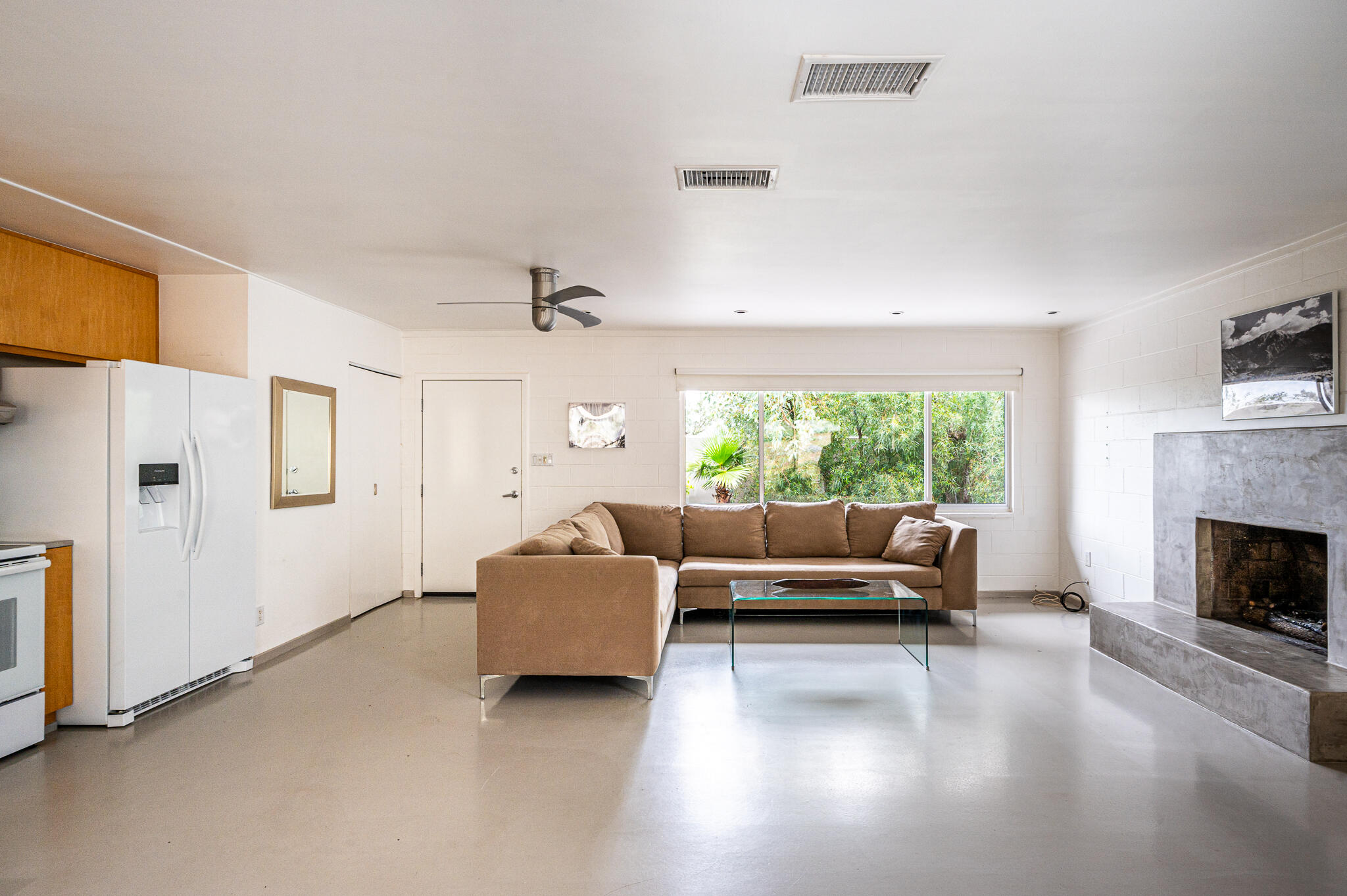 15971 Snowcreek Canyon Road Whitewater, CA 92282 - Photo 6 of 45 a living room with furniture and a fireplace