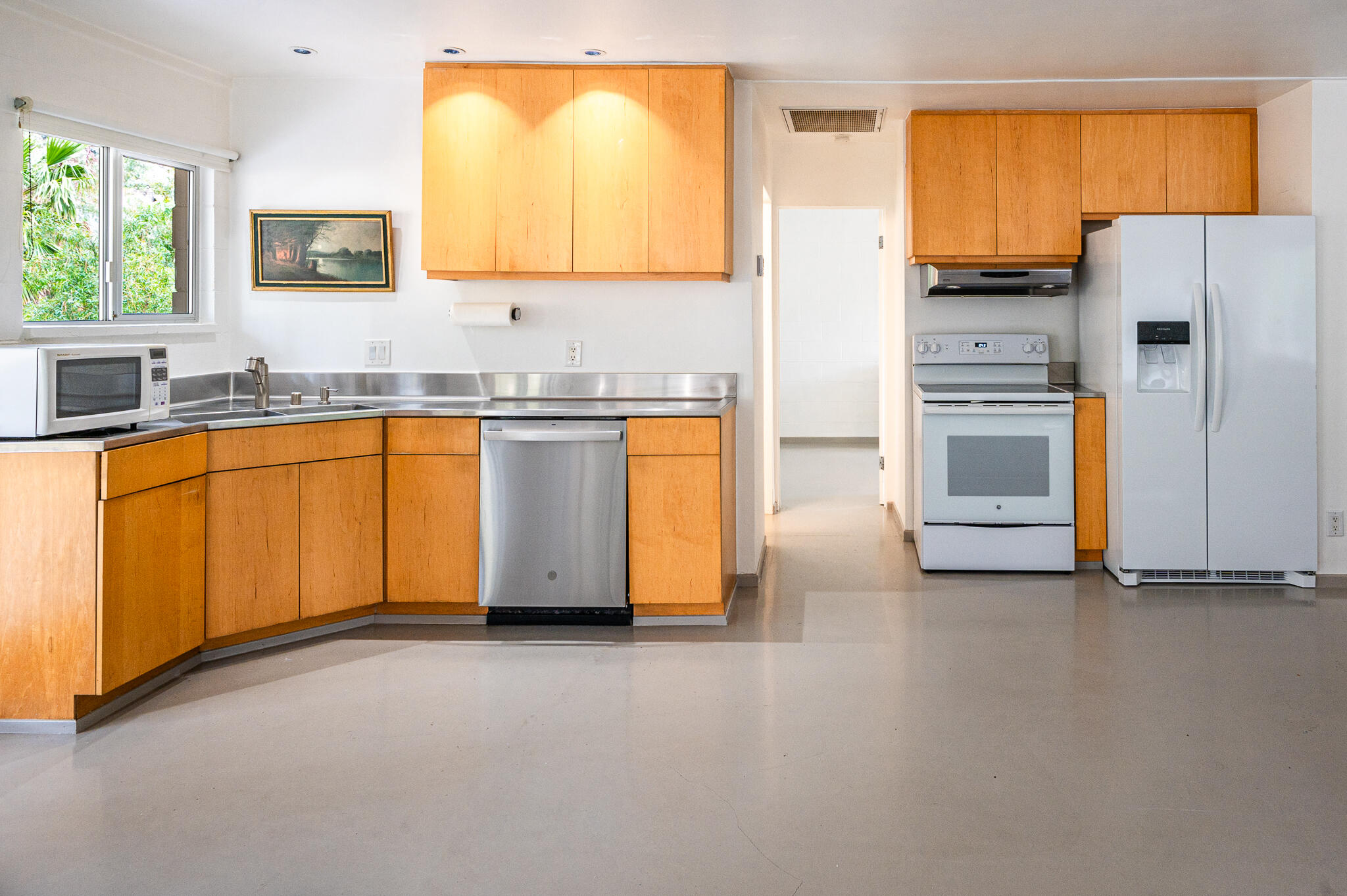 15971 Snowcreek Canyon Road Whitewater, CA 92282 - Photo 10 of 45 a kitchen with stainless steel appliances a refrigerator sink and cabinets