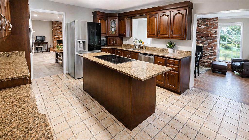 2313 Southeast 7th Street Ocala, FL 34471 - Photo 31 of 54 a kitchen with a sink and cabinets