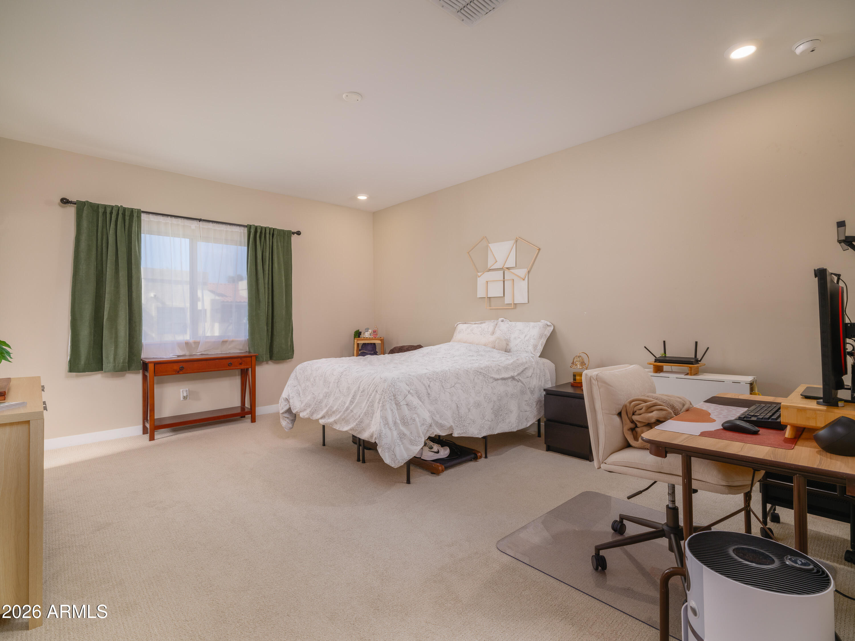 2170 West Harmont Drive Phoenix, AZ 85021 - Photo 11 of 32 a spacious bedroom with a bed a desk and chair