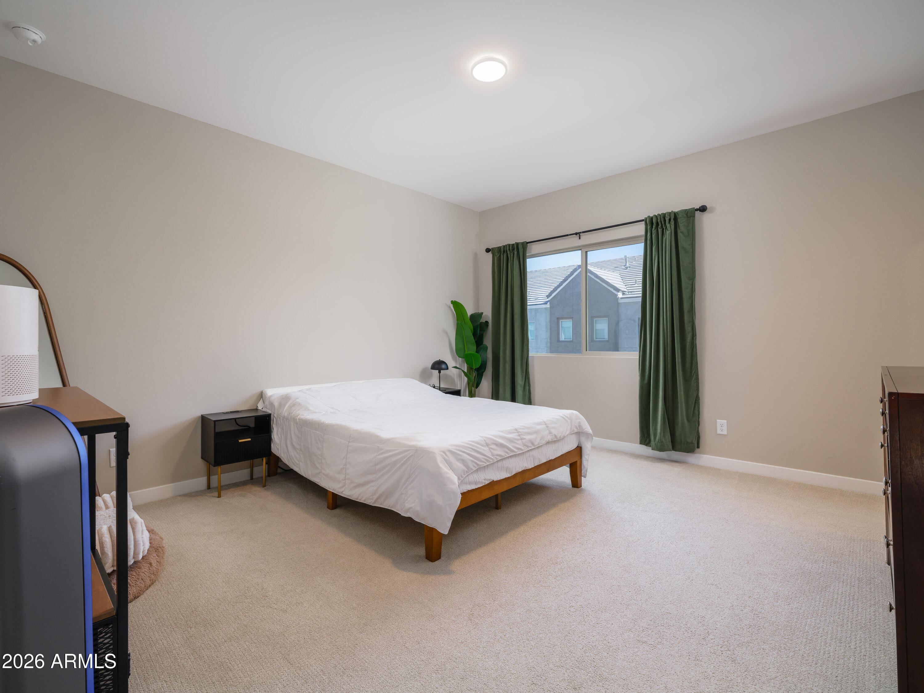2170 West Harmont Drive Phoenix, AZ 85021 - Photo 12 of 32 a bedroom with a bed lamp closet and large window