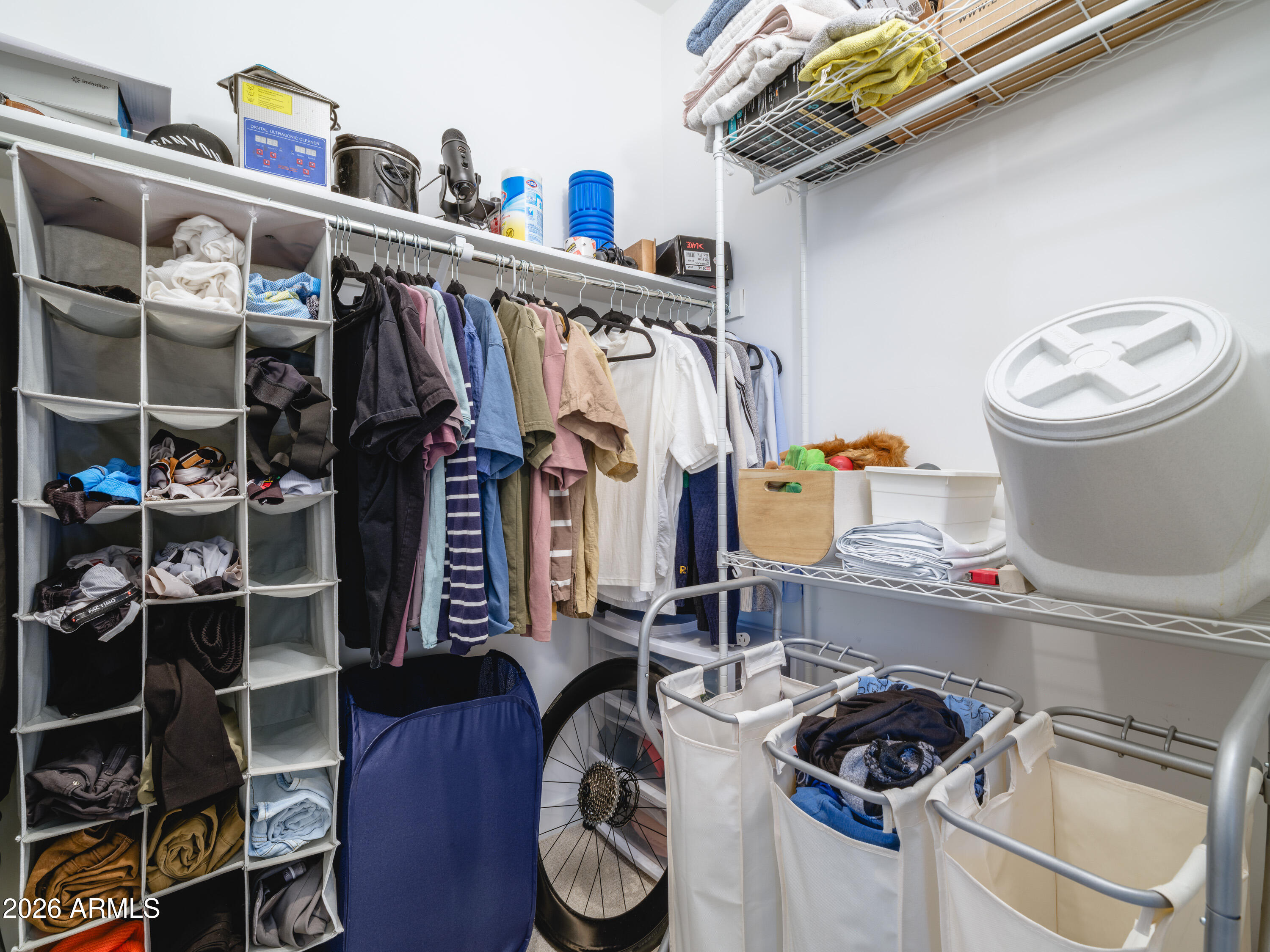 2170 West Harmont Drive Phoenix, AZ 85021 - Photo 13 of 32 a view of walk in closet with clothes and shoes