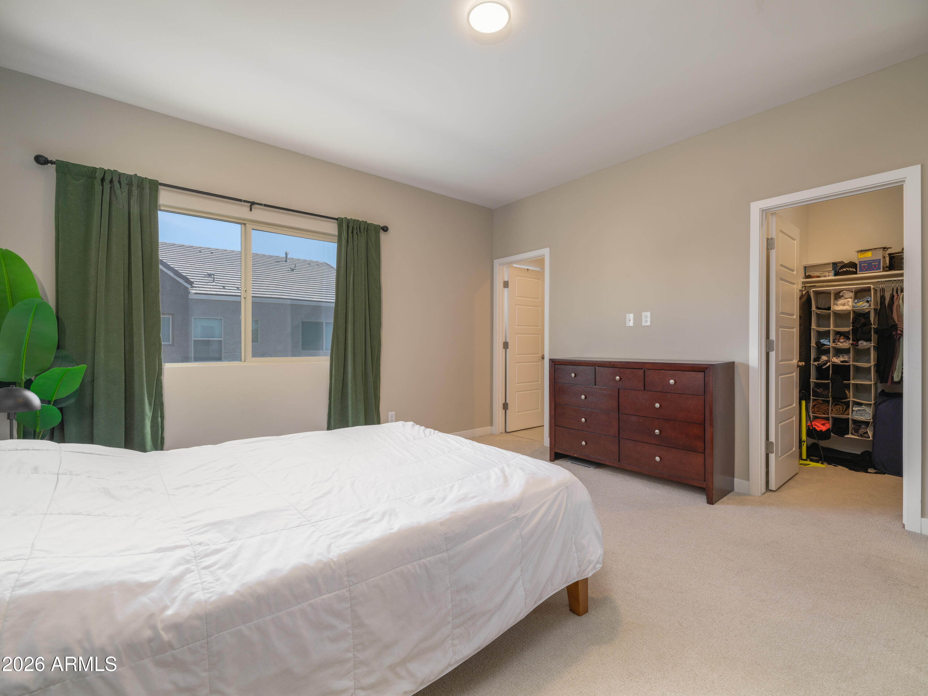 2170 West Harmont Drive Phoenix, AZ 85021 - Photo 14 of 32 a bedroom with a bed and a large window
