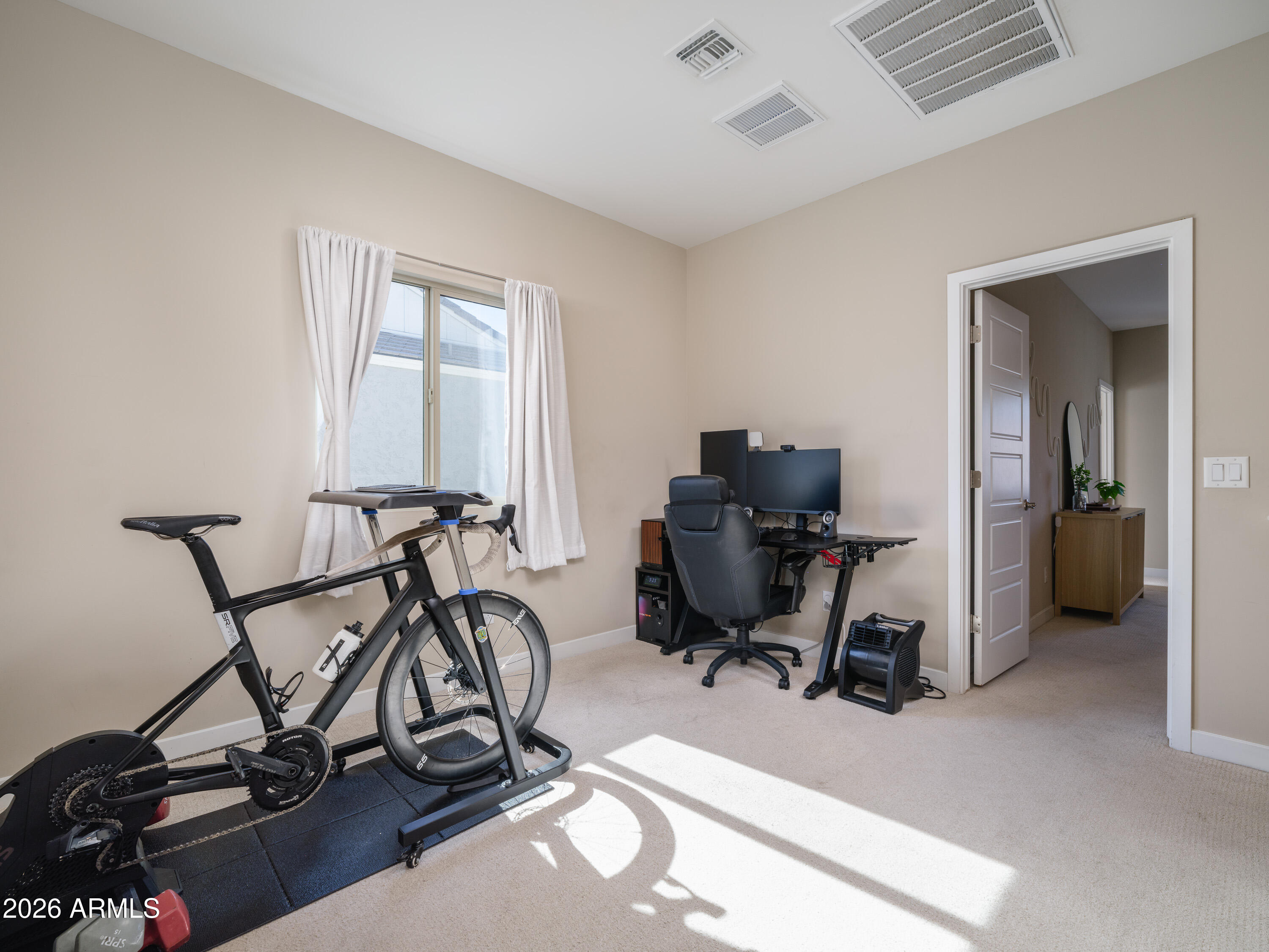 2170 West Harmont Drive Phoenix, AZ 85021 - Photo 17 of 32 a view of a workspace with furniture and a window