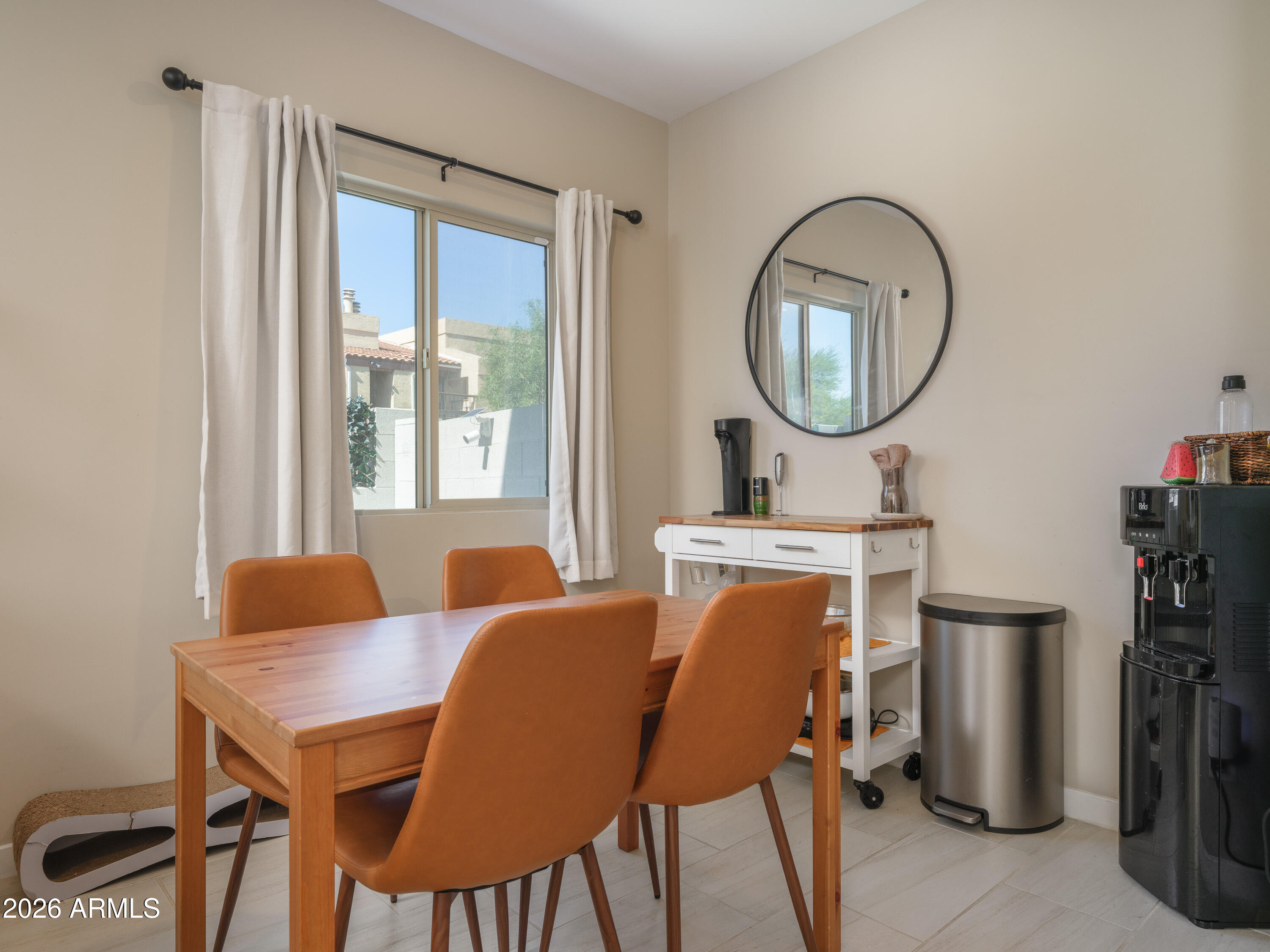 2170 West Harmont Drive Phoenix, AZ 85021 - Photo 6 of 32 a dining room with furniture a mirror and a window
