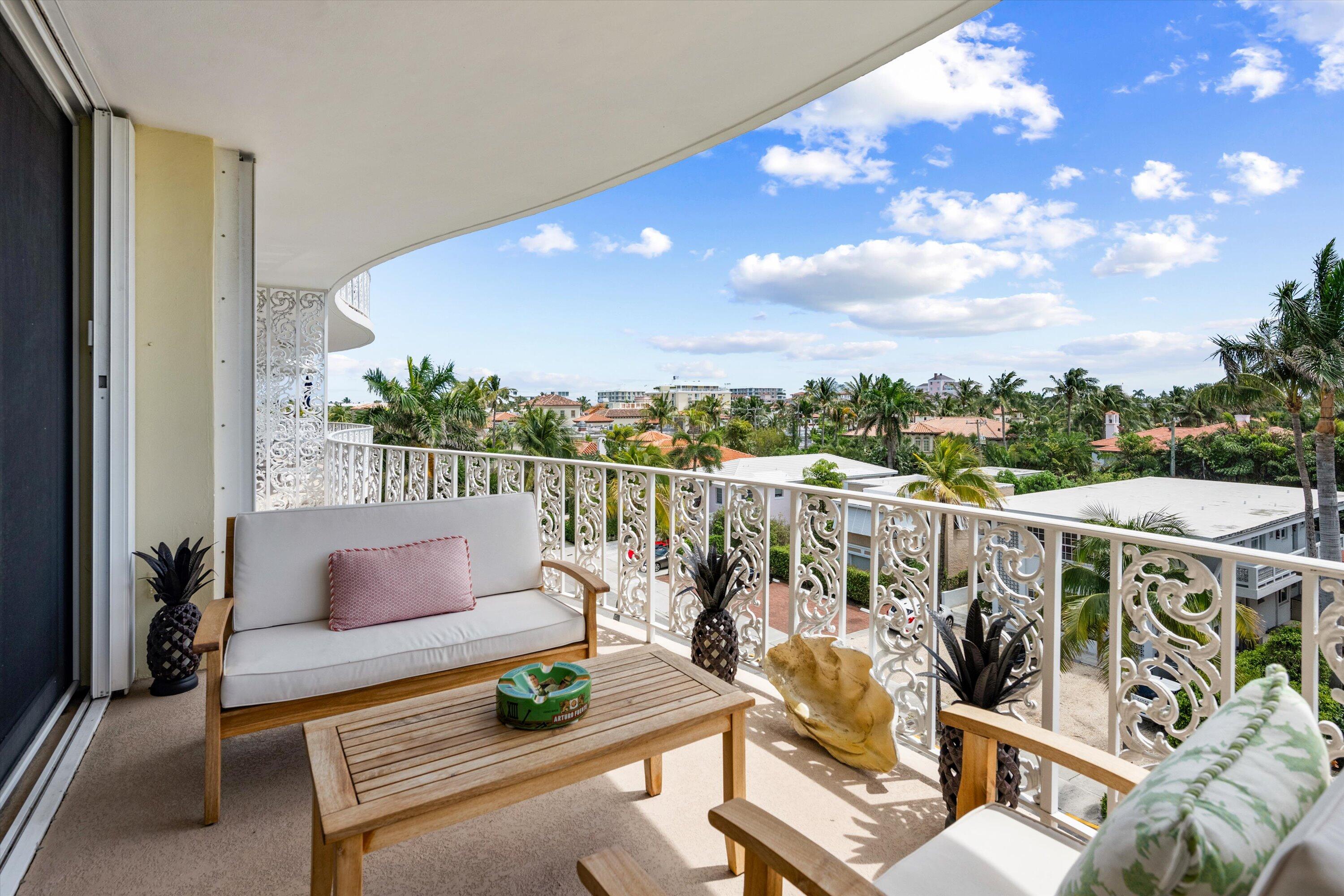 227 Australian Avenue, Unit 4C Palm Beach, FL 33480 - Photo 13 of 16 a roof deck with couches and wooden floor