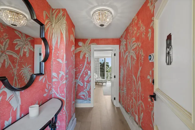 a view of an entryway with wooden floor