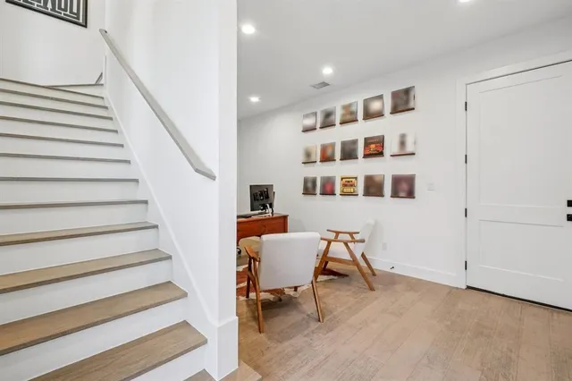 a view of a livingroom with furniture and staircase
