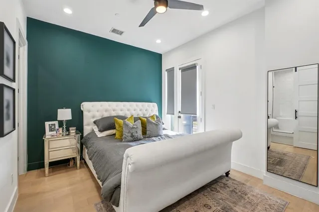 a bedroom with a bed and a couch