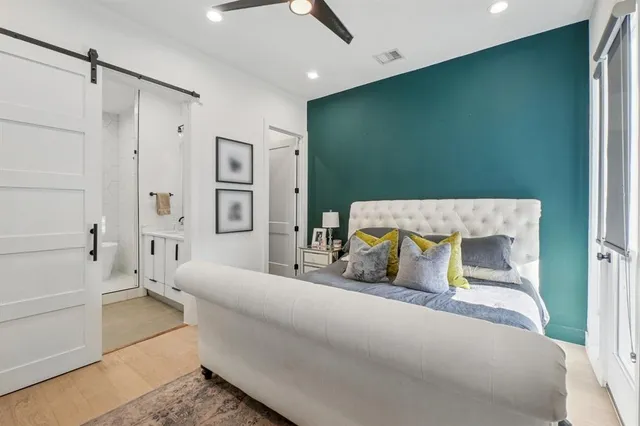 a bedroom with a bed bathroom and walk in closet