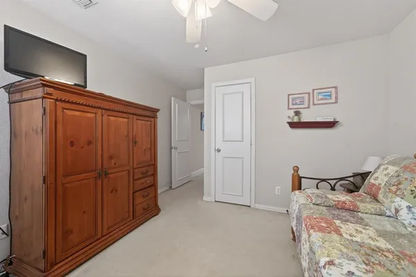 a bedroom with a bed and furniture