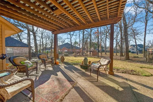 a building outdoor space with patio furniture and swimming pool