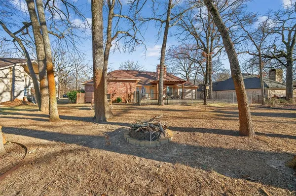 a view of a yard with trees