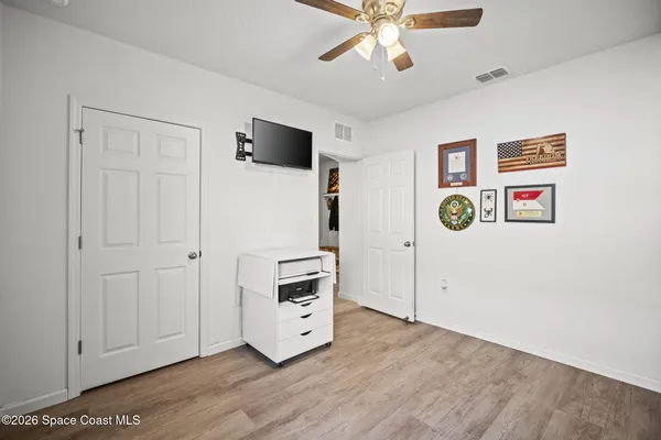 a view of a livingroom with wooden floor