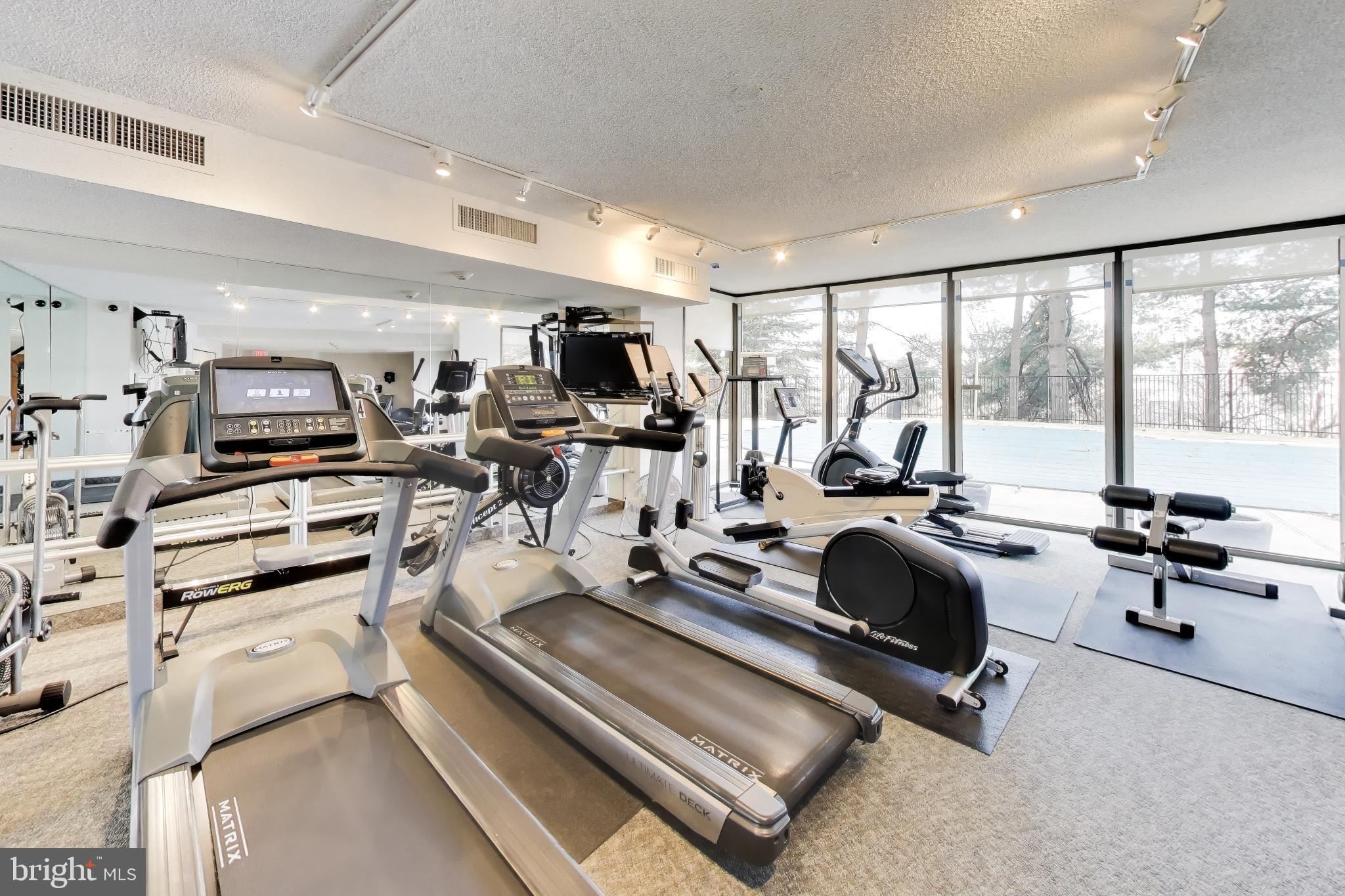 1101 South Arlington Ridge Road, Unit 305 Arlington, VA 22202 - Photo 42 of 51 Gym Overlooking Heated Pool