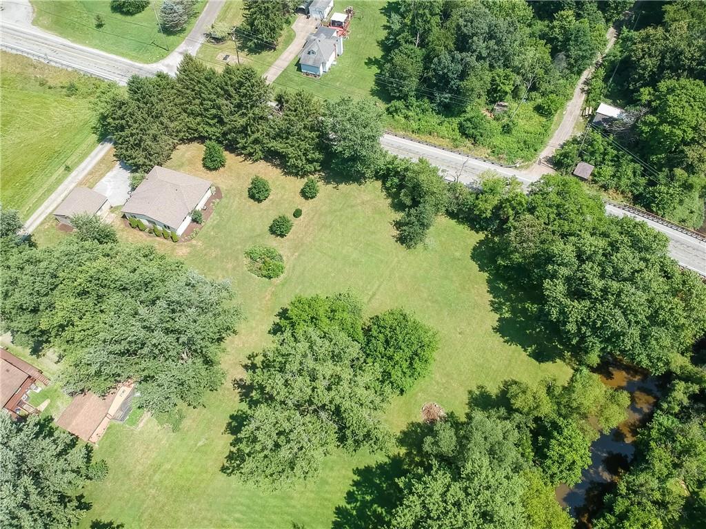 1414 Highway 989 Rochester, PA 15074 - Photo 4 of 38 an aerial view of residential house with outdoor space and trees all around